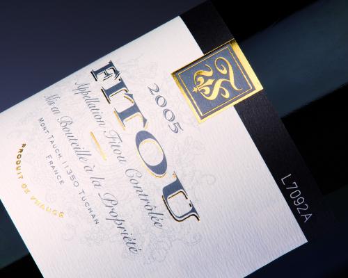 Laser coding on glass beverage bottles, providing permanent and precise markings for branding and traceability.