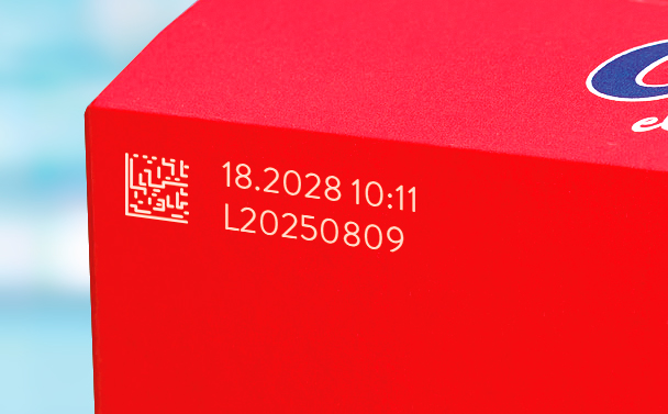 Batch and expiry date coding on red food packaging